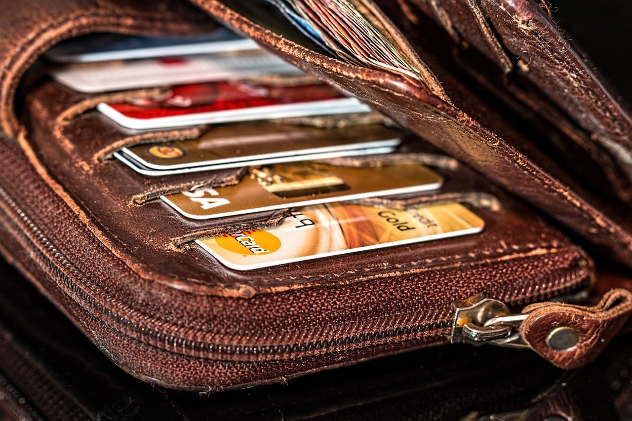 Wallet filled with multiple credit cards.