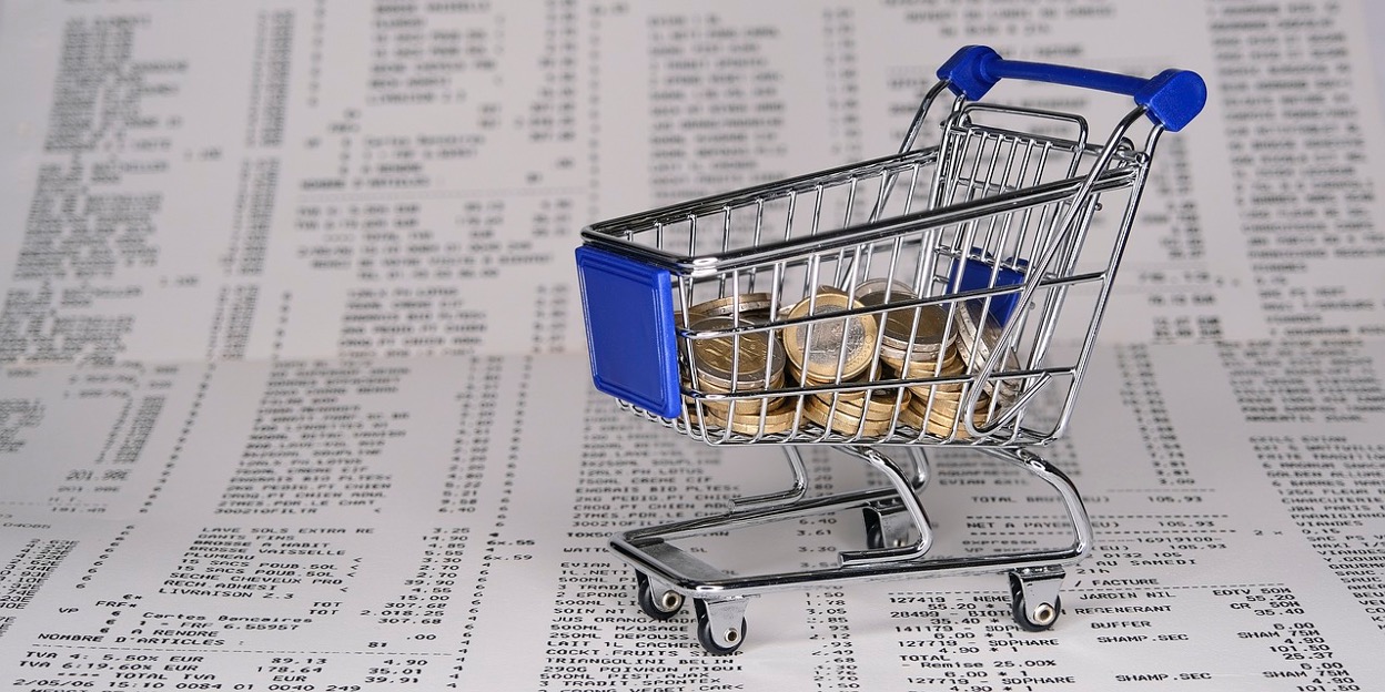 Shopping cart filled with coins